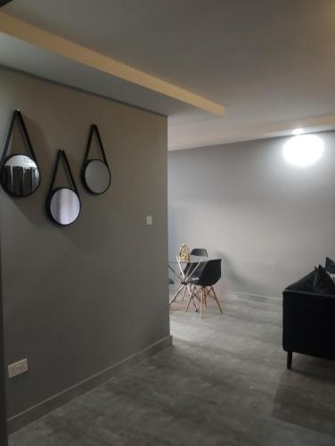 a room with two lights on a wall at Fully serviced apartments solwezi in Solwezi