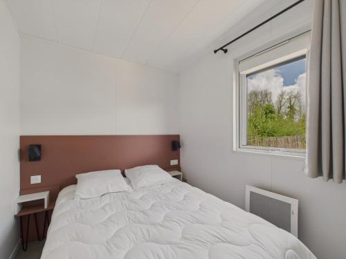 Ένα ή περισσότερα κρεβάτια σε δωμάτιο στο Chalet neuf pour 6 avec piscine chauffée à l'année