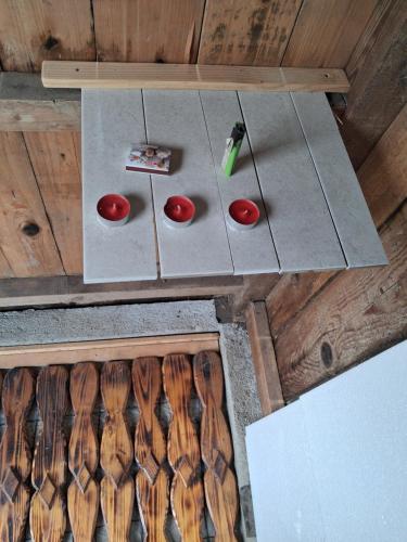 an overhead view of a table with wooden utensils at LAND FOR YOUR TENT NEXT TO A RIVER WITH A GARDEN SHACK ROOM you get two bicycles for amazing views and two water floats for a nice river run USE THE LOCATION NOT THE ADDRESS TO GET HERE bathroom is a bit different so check YouTube video RiverRunDusko in Ljubljana