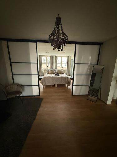 a bedroom with a bed and a large mirror at Saya Loft in Amersfoort