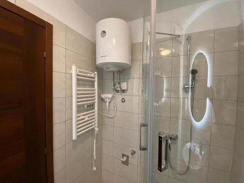 a bathroom with a shower with a glass shower at City center Gold in Split