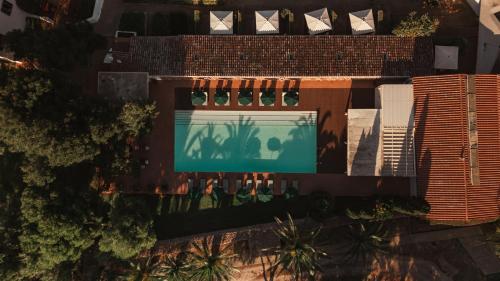 an overhead view of a building with a swimming pool at Binissaida Boutique Hotel in Es Castell