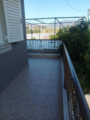 a balcony with a fence and a walkway at Eirini's Apartment in Missolonghi