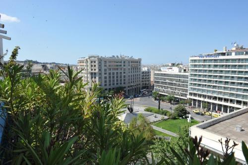 a view of a city with buildings and trees at Hotel Katerina in Athens
