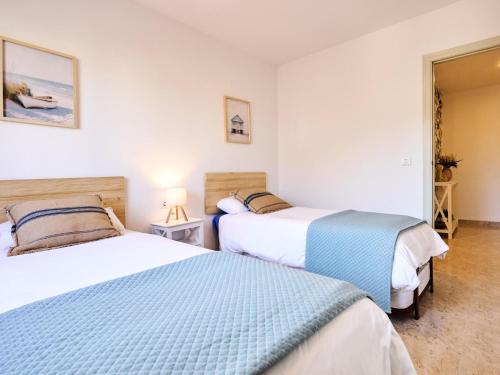 Postel nebo postele na pokoji v ubytování Apartament Mar Blau