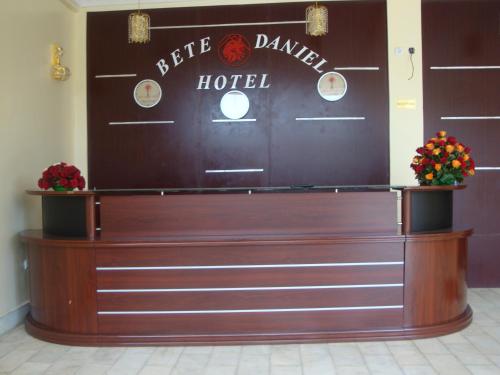 a hotel lobby with a sign on the wall at Bete Daniel Hotel in Bahir Dar