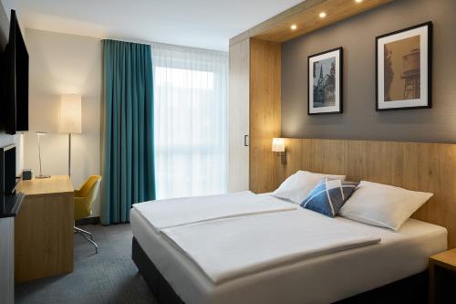Ein Bett oder Betten in einem Zimmer der Unterkunft Four Points Flex by Sheraton Bochum