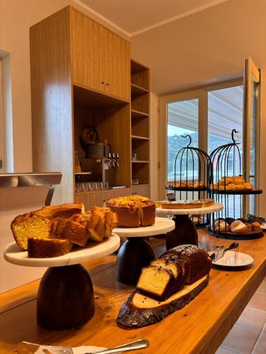 a table with several different types of bread on plates at Villa Cavalletti Appartamenti in Grottaferrata