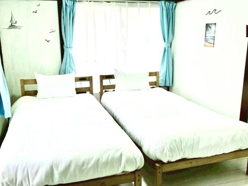 Postel nebo postele na pokoji v ubytování RelaxYN 最大7名 温かみのある和室を一軒貸切り 富士急ハイランドまで車で5分