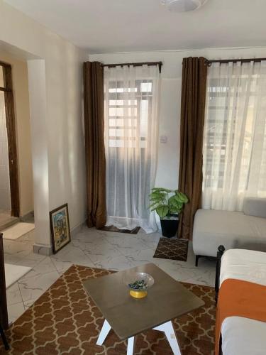 Posezení v ubytování J and L hosting- Lower Kabete rd