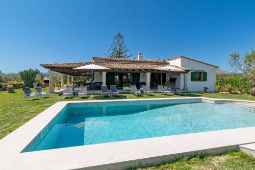 a swimming pool in front of a house at Villa Auba by Sealand Villas in El Port