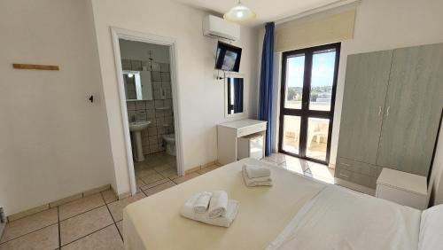 Postel nebo postele na pokoji v ubytování Hotel Baia del Cigno