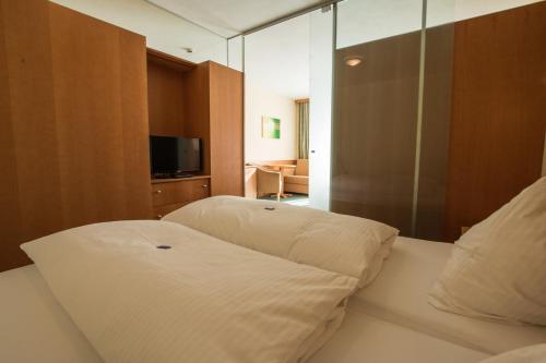 Katil atau katil-katil dalam bilik di Erlebnishotel Fendels