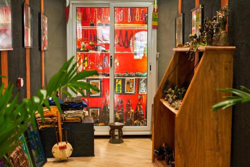 a room with a door that is full of merchandise at ONOMO Hotel Bamako in Bamako