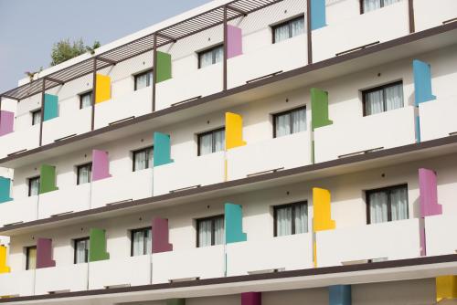 a building with colorful letters on it at ONOMO Hotel Bamako in Bamako