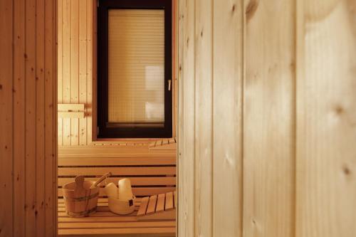 a wooden room with a window and some utensils at Südstrand Bungalow in Burgtiefe auf Fehmarn 