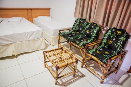 Katil atau katil-katil dalam bilik di Hotel Porto dos Milagres