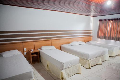 Katil atau katil-katil dalam bilik di Hotel Porto dos Milagres