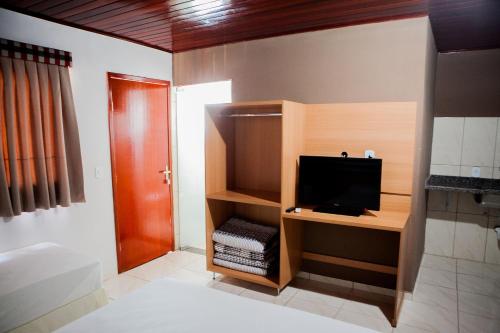 Katil atau katil-katil dalam bilik di Hotel Porto dos Milagres
