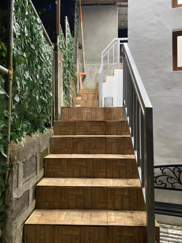 a set of stairs leading up to a house at Nature Home Suites in Lunao