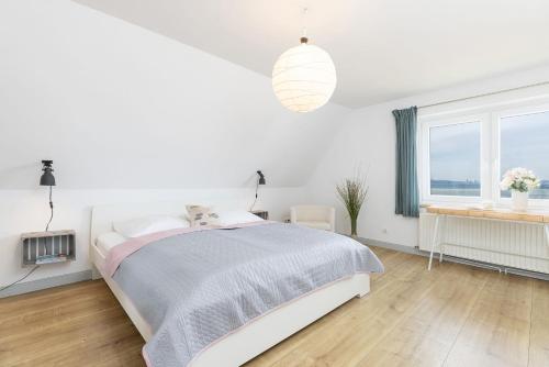 Postel nebo postele na pokoji v ubytování Strandhaus