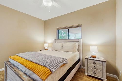 a bedroom with a bed and a window at The Peoria Palms in Peoria