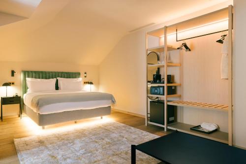 a bedroom with a bed and a book shelf at Pestana Rua Augusta Lisboa in Lisbon