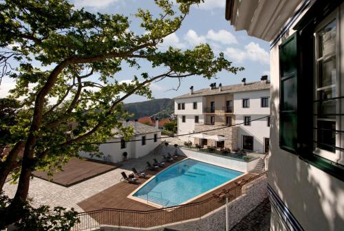 a view of a swimming pool from a building at Despotiko in Portariá