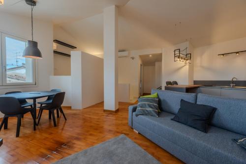 a living room with a couch and a table at Loft Empoli in Empoli