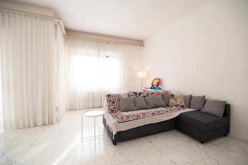 a living room with a couch and a table at Casa di Pier&Chico in Genova