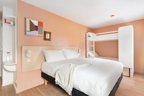 a bedroom with a bed and a bunk bed at greet Hôtel Prévessin Genève Aéroport in Prévessin