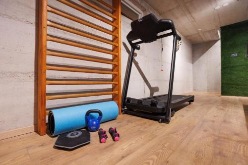 a room with a treadmill and some sandals on the floor at Holiday Home TiA in Split