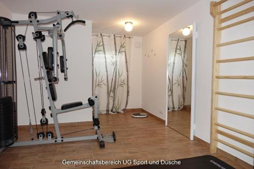 a room with a gym with a treadmill at Kampenweg 8 Brandung in Puttgarden