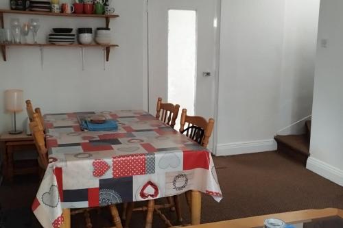 a table with a quilt on it in a room at Cosy Cork - House - Sleeps 4 - City Centre in Cork
