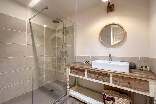 a bathroom with a sink and a shower at Place des Lices - NK in Saint-Tropez