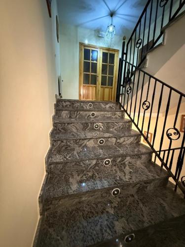 a set of stairs leading up to a door at Nuevo Hostal Rasil in Nohales