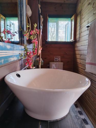 a white bath tub in a bathroom with a window at Breb s Cosy Barn in Breb
