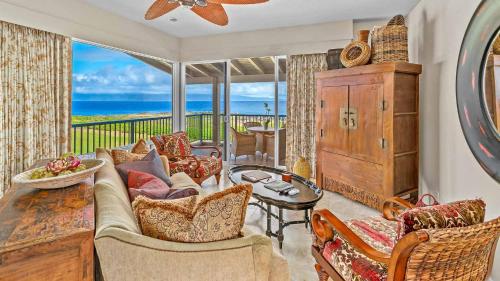 a living room with a couch and a view of the ocean at Kapalua Bay Villa 35B2 in Kapalua