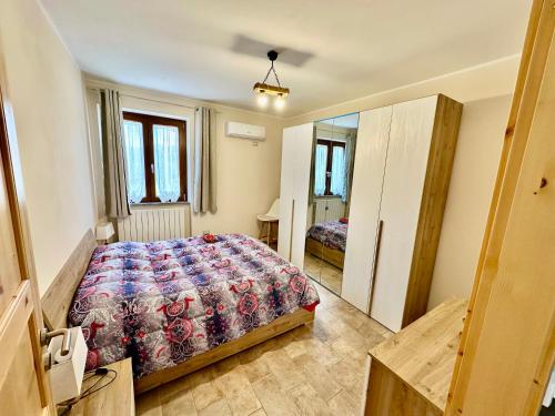 a bedroom with a bed in a room at Villa Tuscia apartments in Tuscania