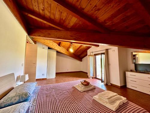 a bedroom with a bed and a table in it at Villa Tuscia apartments in Tuscania