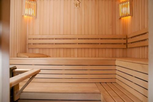 a wooden sauna with a wooden floor and a wooden at Kryve Ozero in Novoyavorivsk