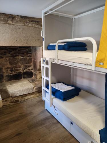 a bunk bed room with two bunk beds at Albergue SP 55 by Bossh! Hotels in Santiago de Compostela