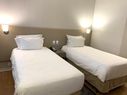 Una cama o camas en una habitación de Staybridge Suites São Paulo by IHG