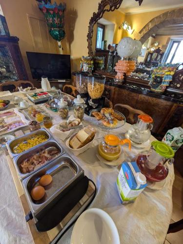 a table with a buffet of food on it at Villa Nicolaci - Liberty Suites in Noto