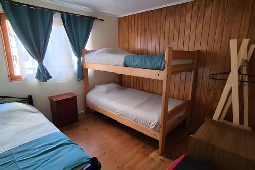 Postel nebo postele na pokoji v ubytování Algarrobo Cabaña a 2 cuadras Playa El Canelo+Wifi