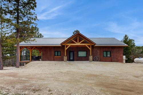 a house with a large driveway in front of it at Bear Butte Hideaway in Deadwood
