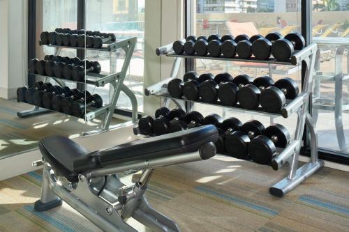 a rack of dumbbells in a gym at Holiday Inn Express Waikiki by IHG in Honolulu