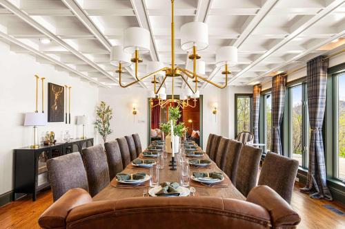 a dining room with a long table and chairs at The Albatross Estate & Golf Links in Fletcher