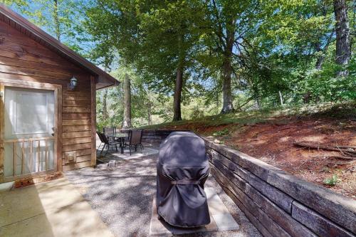 a chair sitting on a fence next to a cabin at NautiPine Lodge in Sevierville