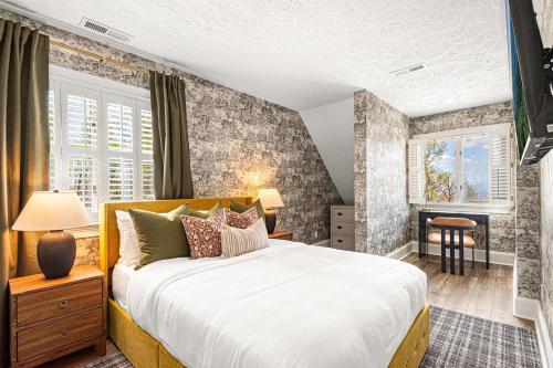 a bedroom with a large bed and a window at The Albatross Estate & Golf Links in Fletcher